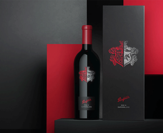 Penfolds Superblend 802-A bottle with black gift box against red and charcoal textured background