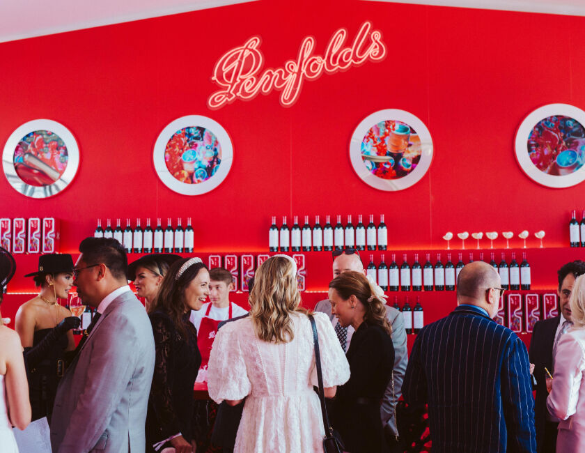 Penfolds Derby Day guests mingling in front of bar