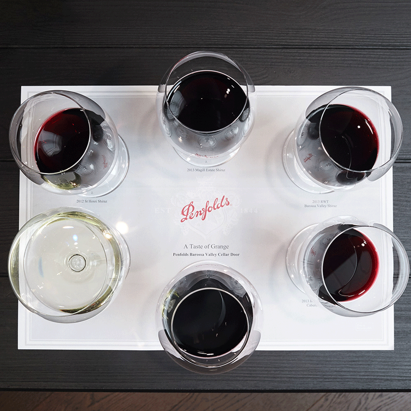 Overhead photo of a tasting mat with 6 filled with glasses