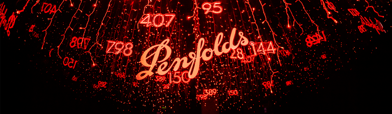 Penfolds logo amidst sea of red neon lights