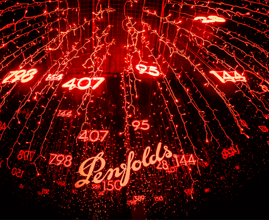 Penfolds logo against red neon background