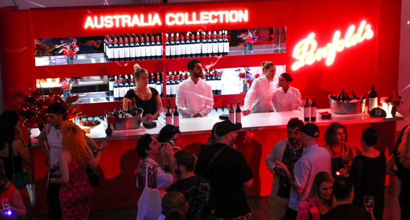 Red Penfolds wine bar at the event. 'Australian Collection' neon signage appears above the bar.