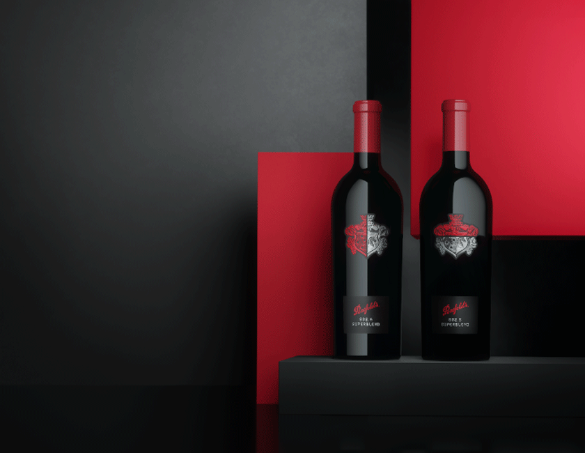 Two Superblend bottles against red and black background