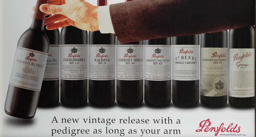 'A new vintage release with pedigree as long as your arm'. 1950s advertising for Bin 28 Shiraz. Hand reaches for bottle