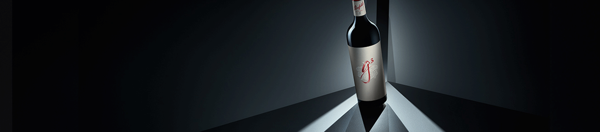 Penfolds g3 bottle on angle with strong blue shadows