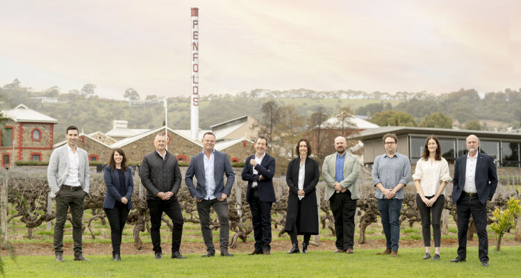 Penfolds winemaking team at Magill Estate winery. Vineyards appear hehind them