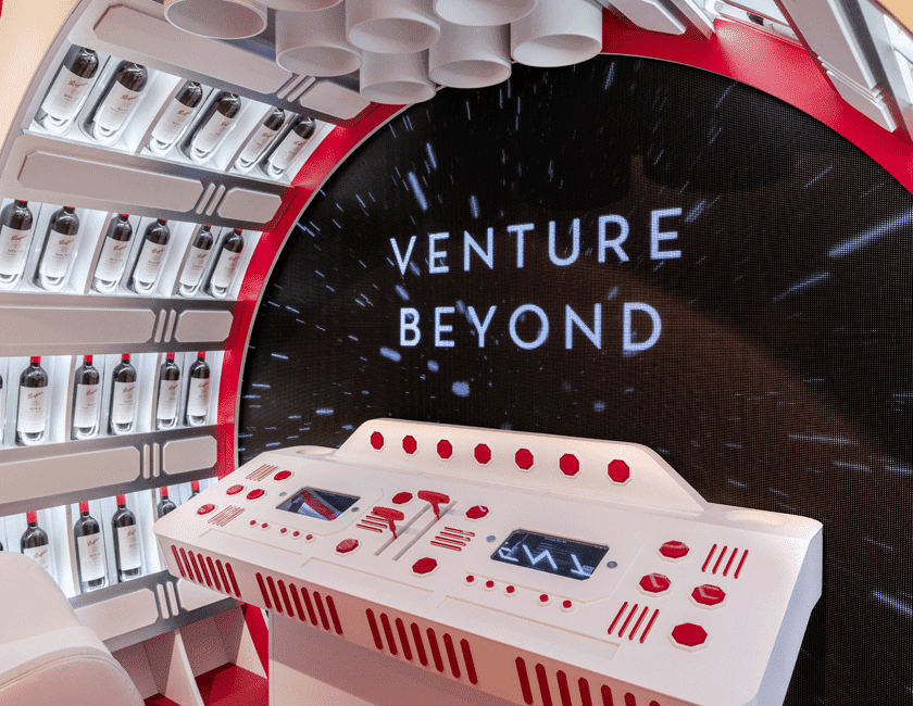 Spaceship console with Penfolds bottles surrounding and video screen in front