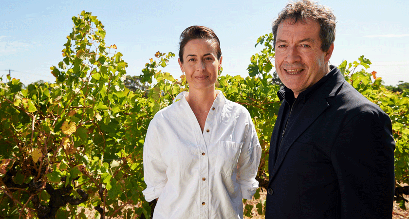 Penfolds Winemakers Steph Dutton and Peter Gago stand in front of summer vines