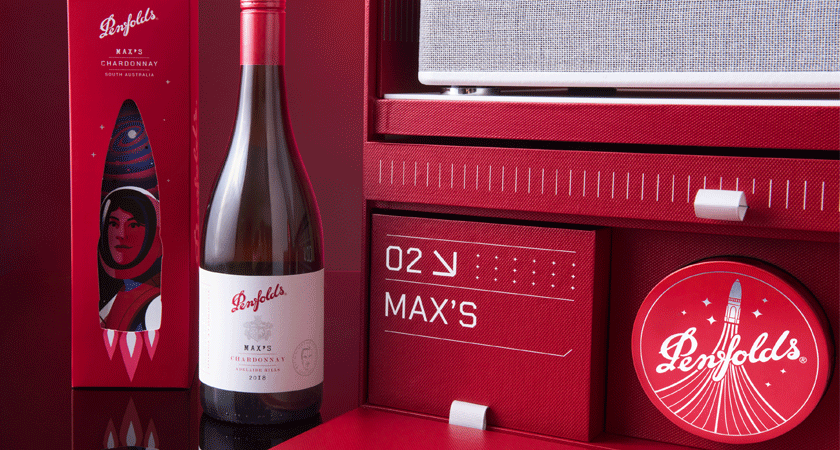 Close up of record player drawer with Penfolds Chardonnay bottle beside