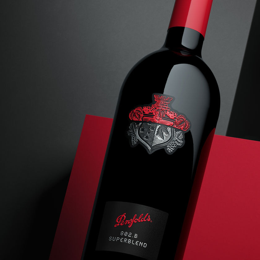 Close up of Superblend 802-B bottle with red and charcoal background