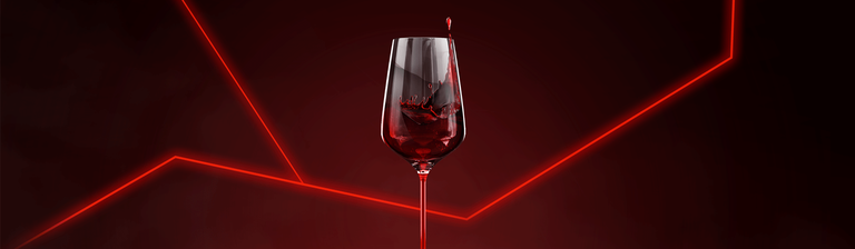 Red wine glass against red neon background