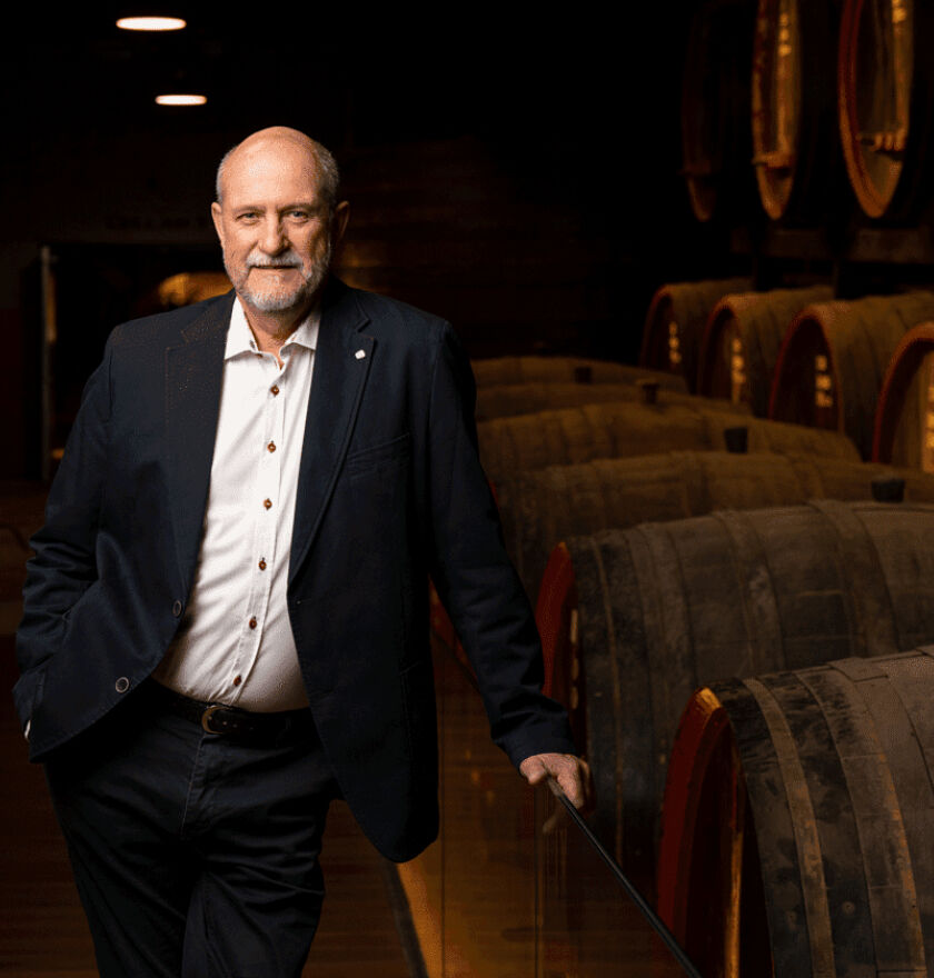 James Godfrey, Penfolds Fortified Winemaker, stands in the warmly lit tunnels of the winery