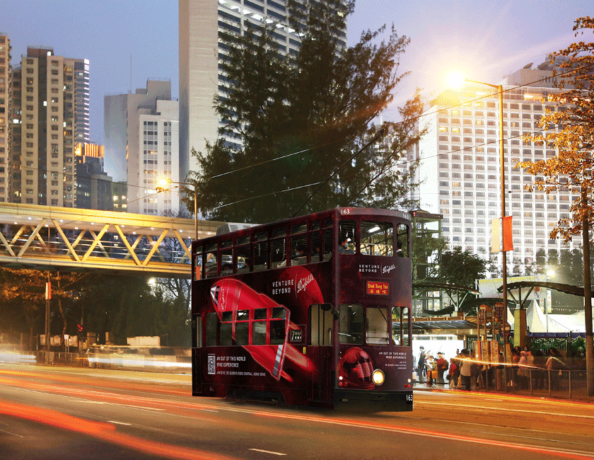 Double decker Penfolds Promotional bus driving through street in Hong Kong