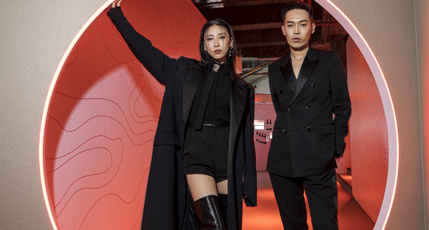 Mae Tan and Jack Wang pose in a doorway at Venture Beyond by Penfolds Singapore