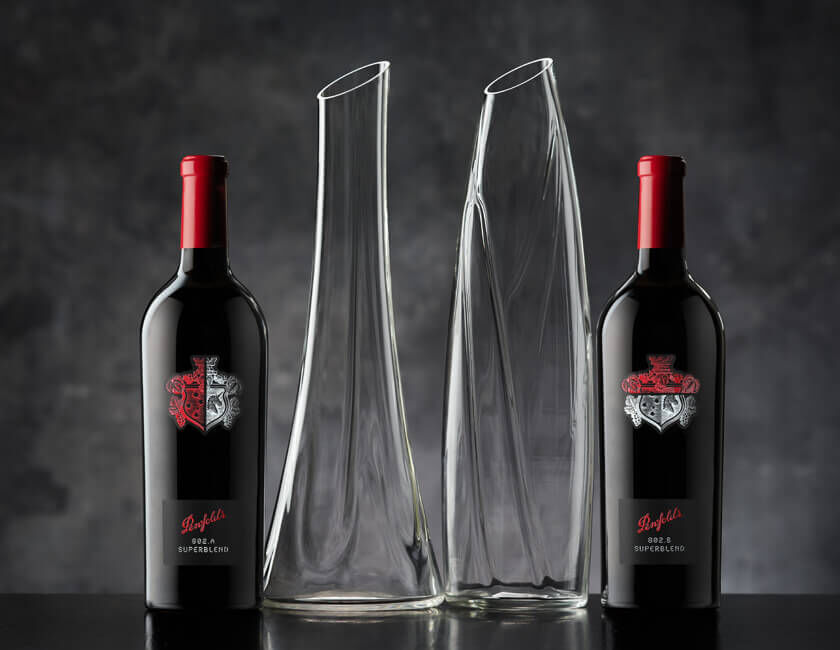 Two Superblend wine bottles with two glass Decanters