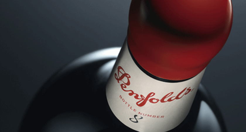 Close up of Penfolds g5 bottle capsule.  Red wax top with bottle number 8 visible on neck