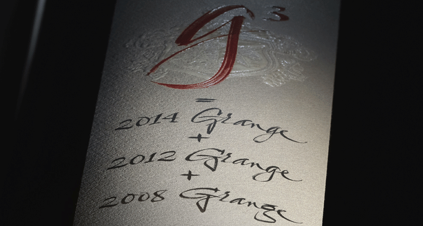 Close up of Penfolds g3 back label.  Calligraphy script shows g^3, 2014 Grange, 2012 Grange and 2008 Grange