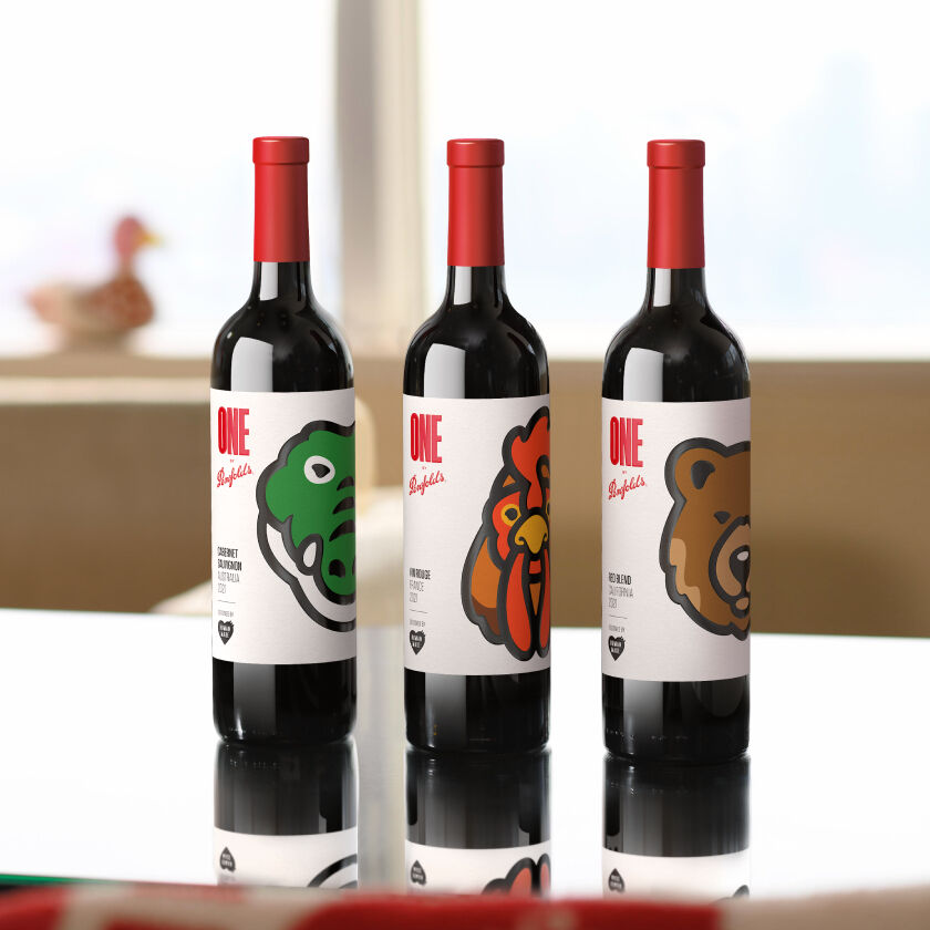 Three bottles on a table.  Each has coloured animal graphics