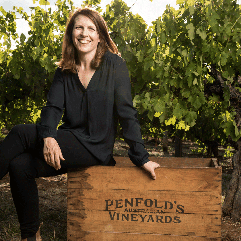 Shavaughn Wells, Penfolds Winemaker, sits on a wooden wine crate in the vineyards