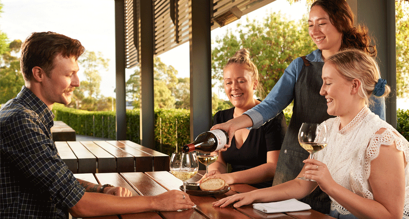 Guests dining outside at Magill Estate kitchen