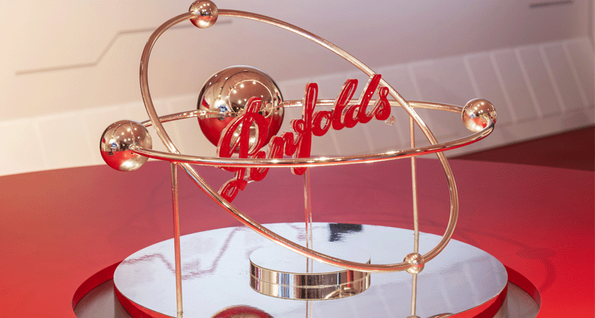 Gold globe with red Penfolds logo centred