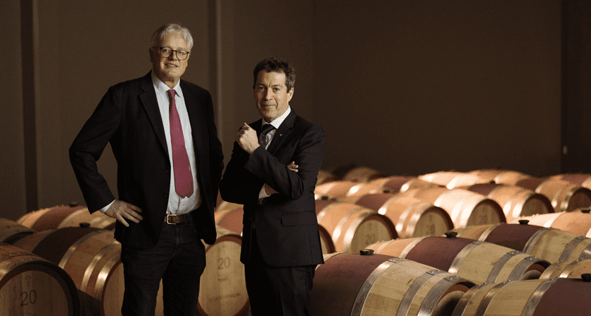 Andrew Caillard MW and Peter Gago stand in the Grange barrel hall at Magill Estate, surrounded by new American oak wine barrels