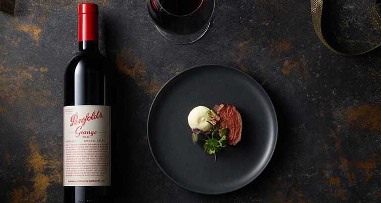 Penfolds Grange flat lay next to steak